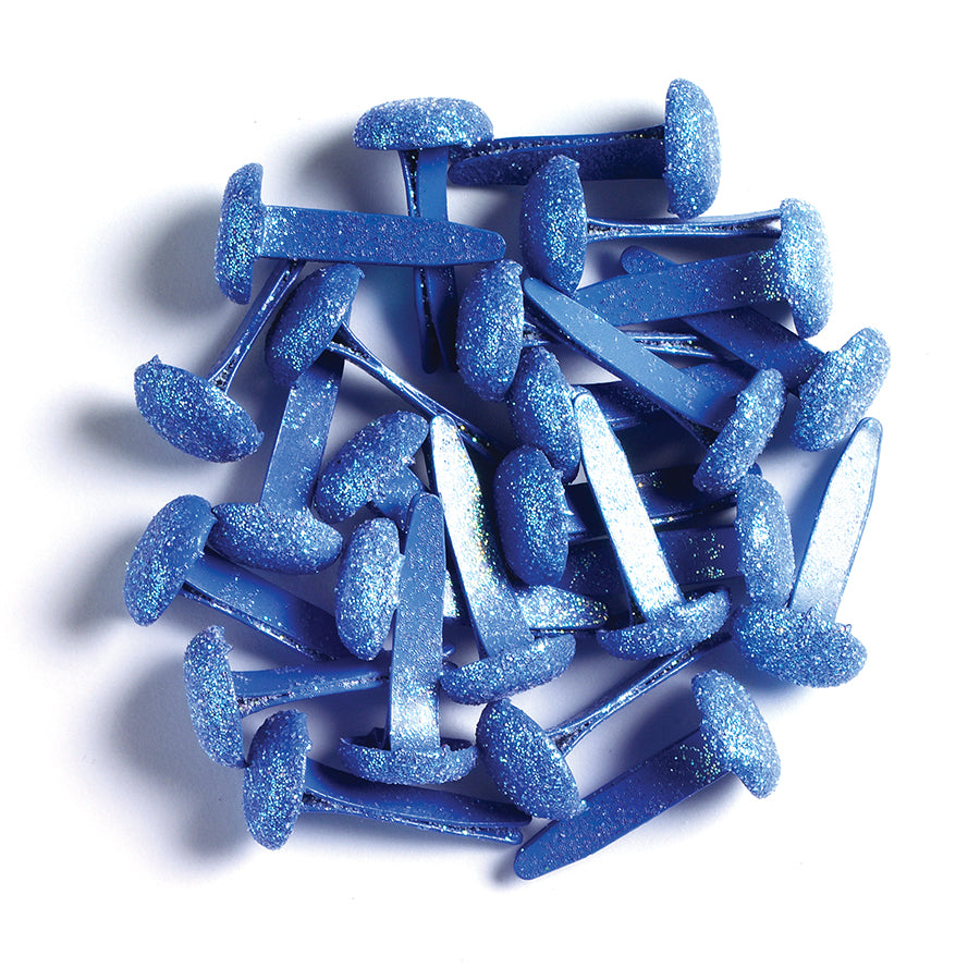 Blue glitter brads on a white background
