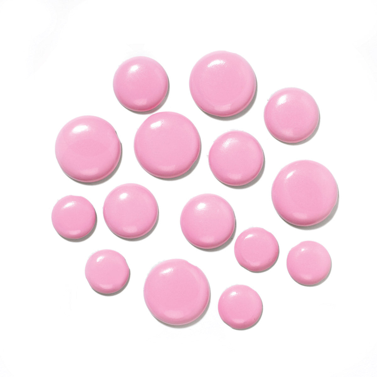 Pink brad tops in various sizes on a white background