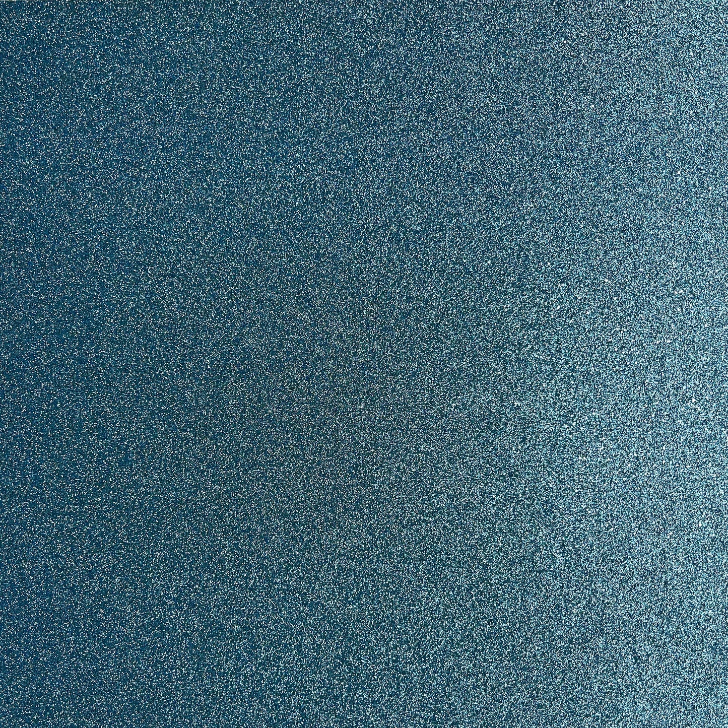 A close-up texture of a dark blue glittery paper with fine silver and light blue speckles.