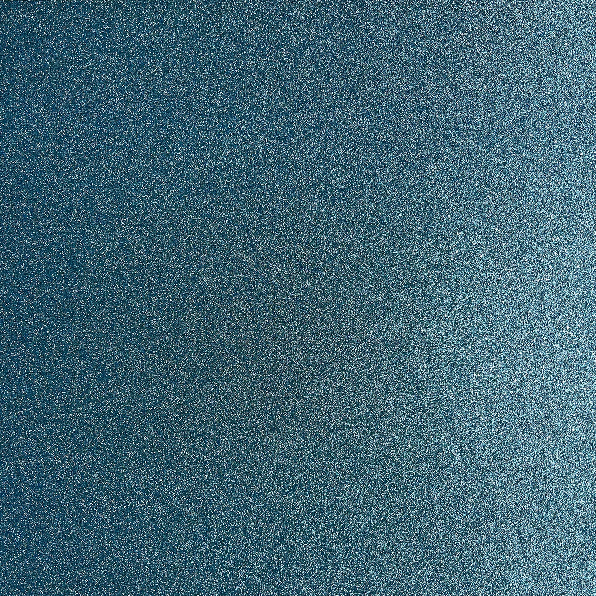 A close-up texture of a dark blue glittery paper with fine silver and light blue speckles.