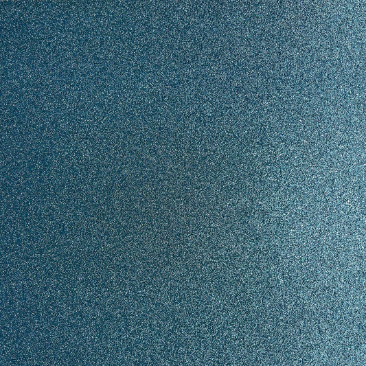 A close-up texture of a dark blue glittery paper with fine silver and light blue speckles.