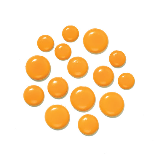 Orange round brads on a white background