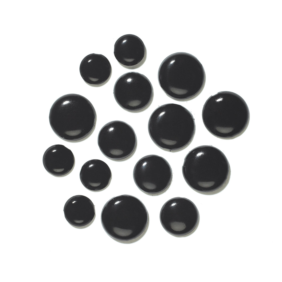 Set of black metal brads/paper fasteners on a whit background