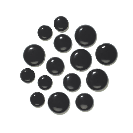 Set of black metal brads/paper fasteners on a whit background