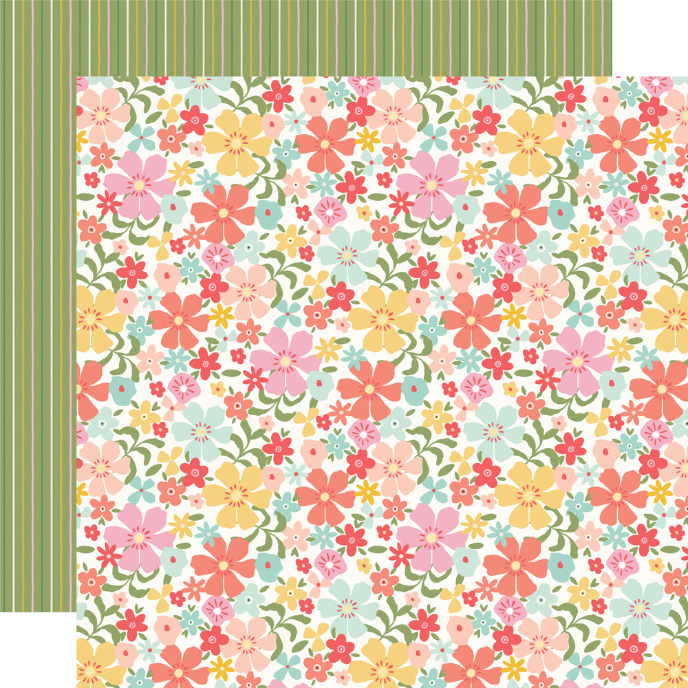 Floral patterned paper with pink, yellow, and blue flowers on a green background