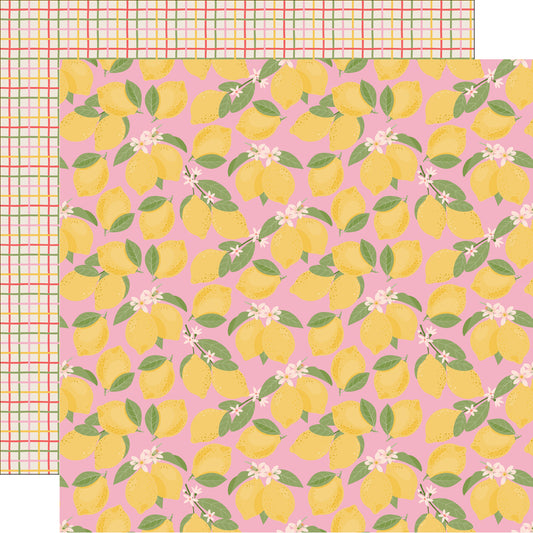 Patterned paper with yellow lemons and green leaves on a pink background