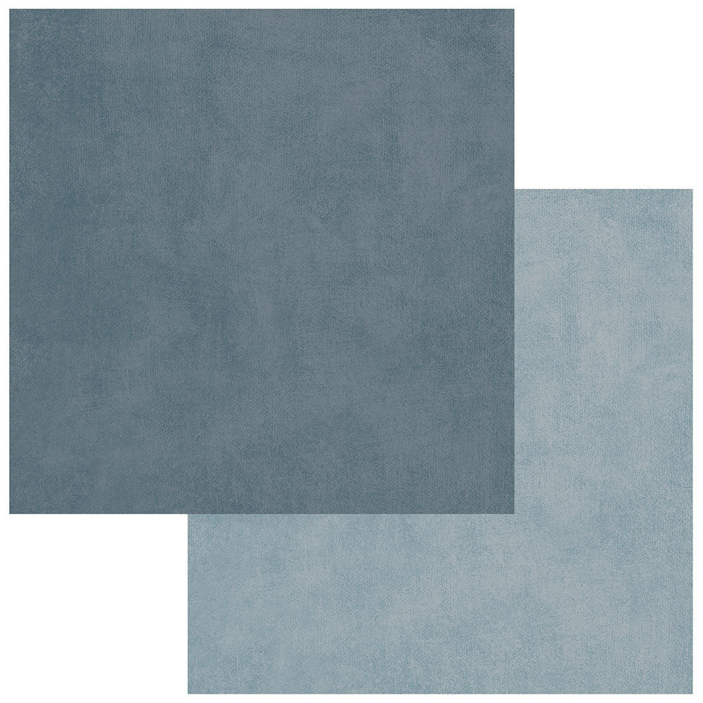 Two square fabric or material swatches in muted blue-gray tones, with one darker swatch partially covering a lighter swatch on a white background.