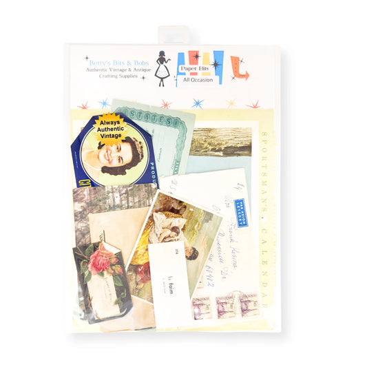 A clear plastic bag containing a vintage-themed collage of assorted paper ephemera, including postcards, letters, and stickers, with the brand name 'Betty's Bits & Bobs printed at the top.