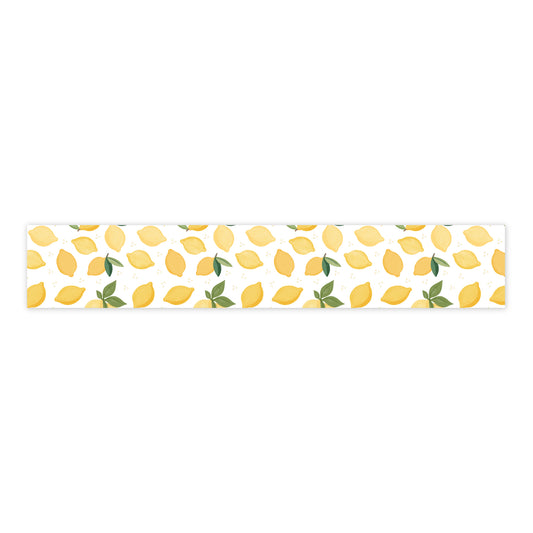 Strip of washi tape with lemon pattern on a white background