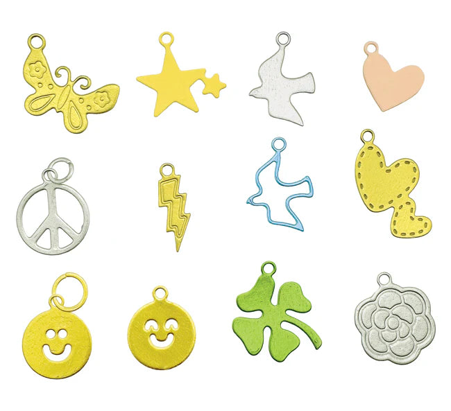 Collection of various colorful metal charms on a white background