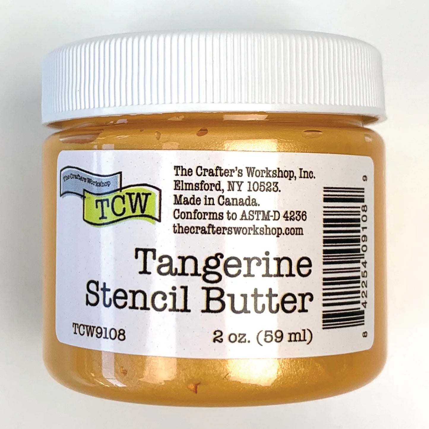 A jar of Tangerine Stencil Butter by The Crafter's Workshop, Inc. The product is in a clear plastic jar showing the golden-orange butter inside, topped with a white ribbed screw-on lid and a white paper label with black text and a barcode.