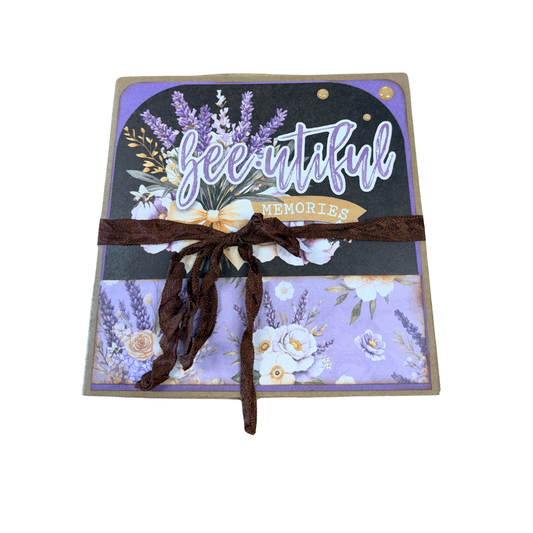 Decorative notebook with floral design and 'beautiful memories' text on a white background