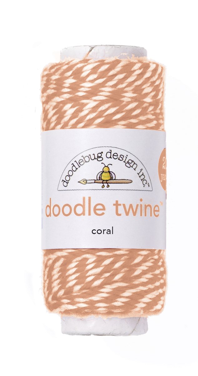 Spool of coral doodle twine with Doodlebug Design label on a white background