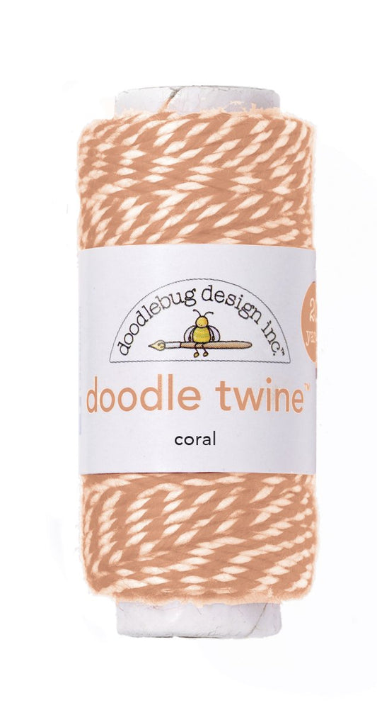 Spool of coral doodle twine with Doodlebug Design label on a white background
